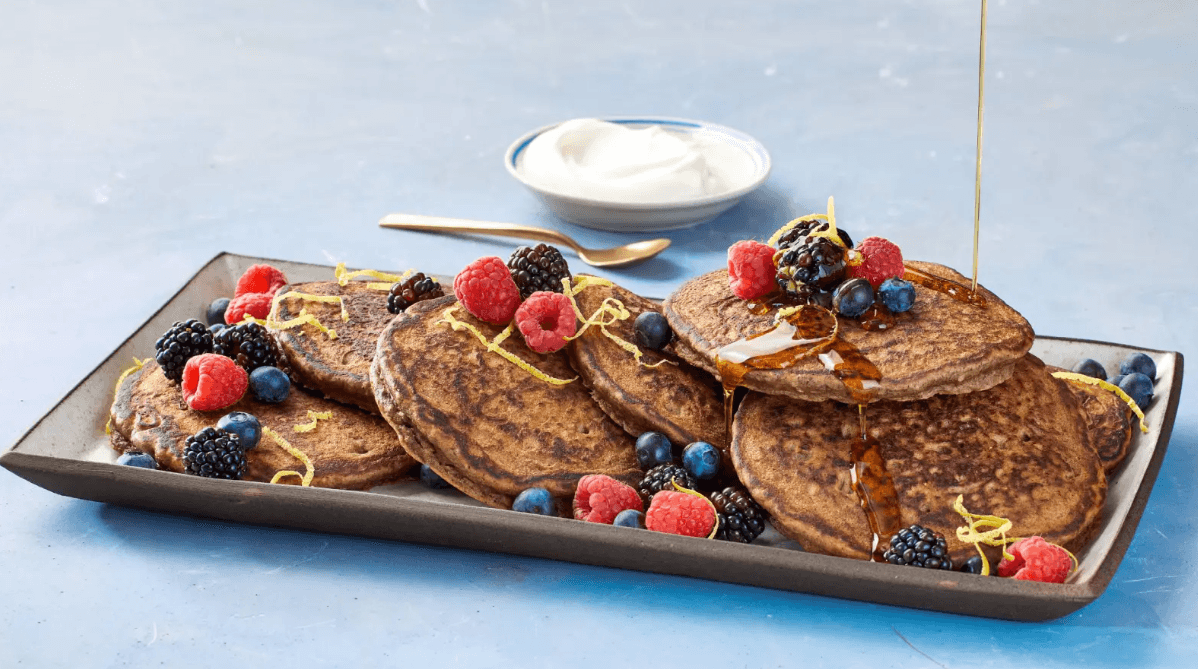 High protein pancakes with berries and syrup